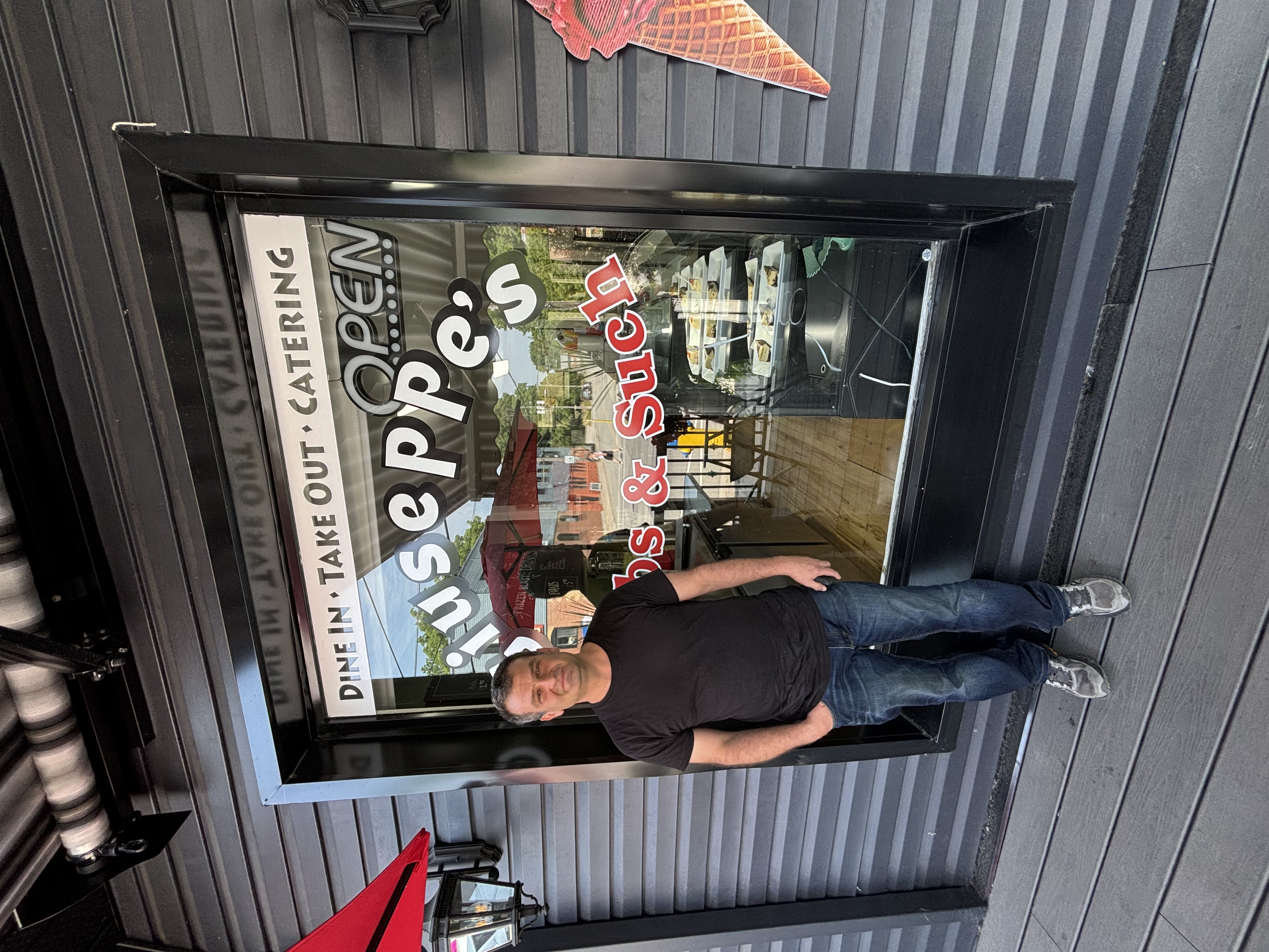 Joe owner of Giuseppes in Sutton standing in front of business