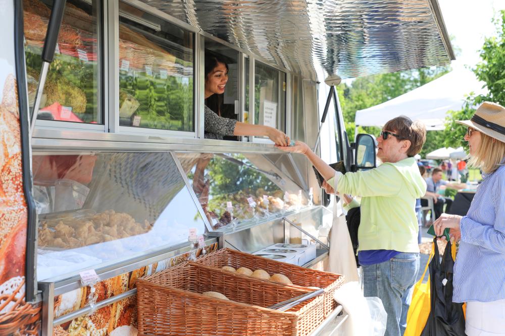 Women purchasing food from a food truck